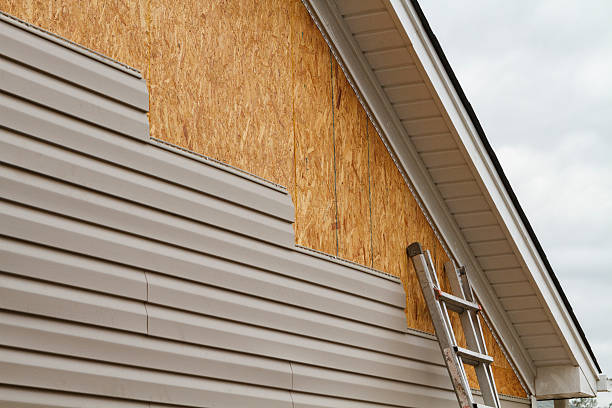 Professional Storm Damage Siding Repair technician working in East Palestine, OH